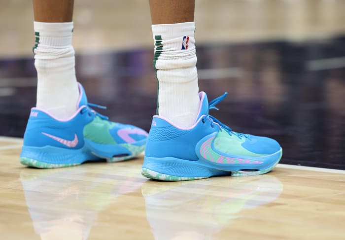 View of Giannis Antetokounmpo's blue and green Nike shoes.